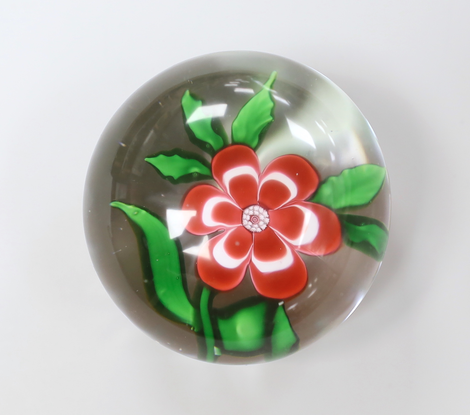 A Baccarat primrose paperweight, approximately 5cm diameter